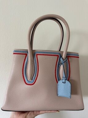 Kate Spade Leather Tote with Blue & Red Trim with a Long Strap.